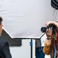 A photographer takes a headshot at a Career Bootcamp